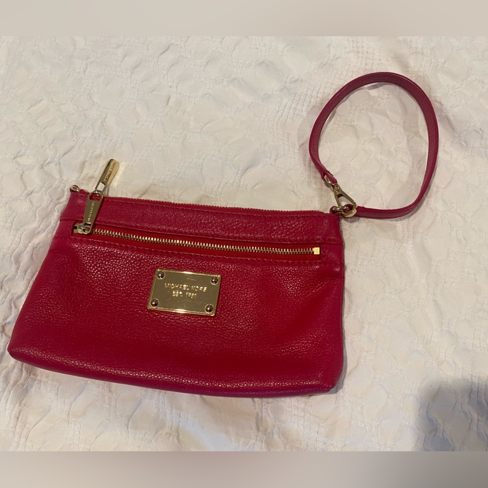 Michael Kors dark pink leather wristlet/clutch.